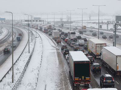 photo of snowy motorway and traffic