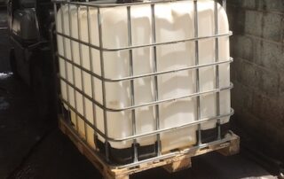 intermediate bulk container in cage
