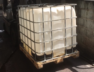 intermediate bulk container in cage