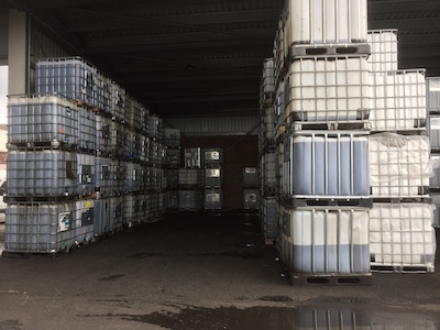 crates of intermediate bulk containers in open warehouse area